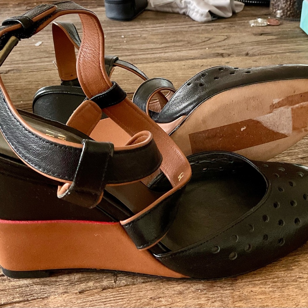 Stuart Weitzman Black and Tan Wedge Shoes with Perforated Design